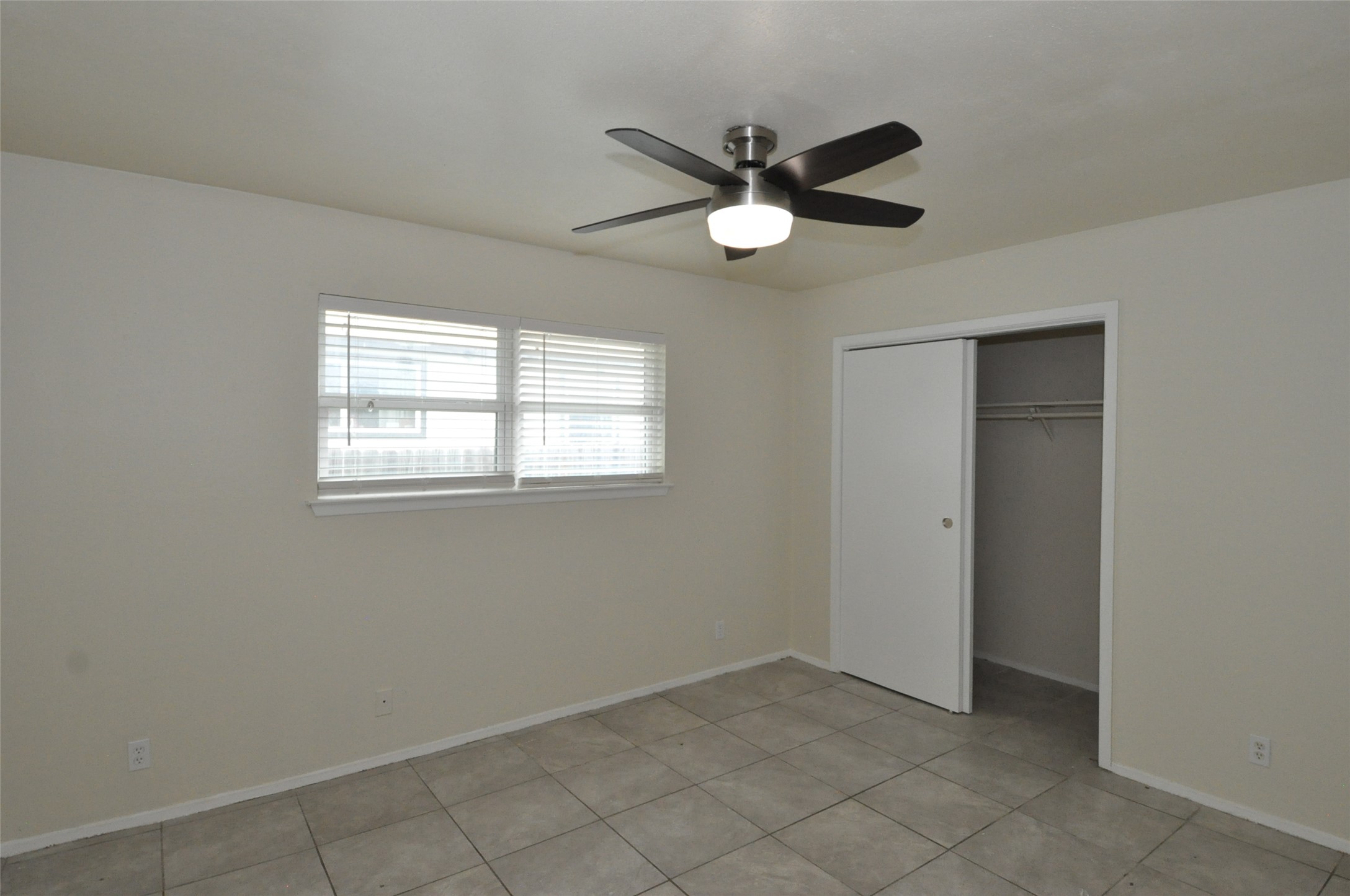 9910 Brasher Drive, Unit B Austin, TX 78748 - Photo 7 of 11 a view of a livingroom with a fan & a window