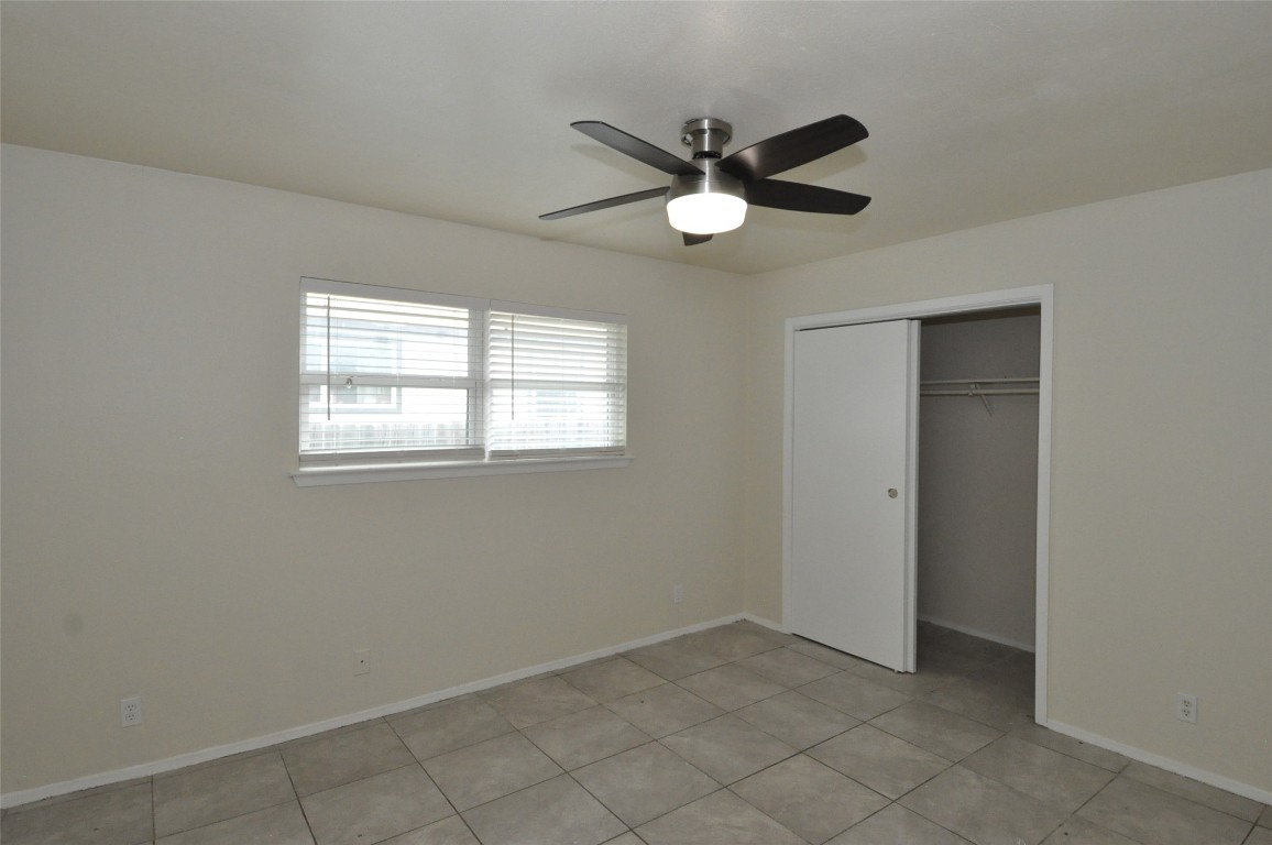 9910 Brasher Drive, Unit B Austin, TX 78748 - Photo 7 of 11 a view of a livingroom with a fan & a window