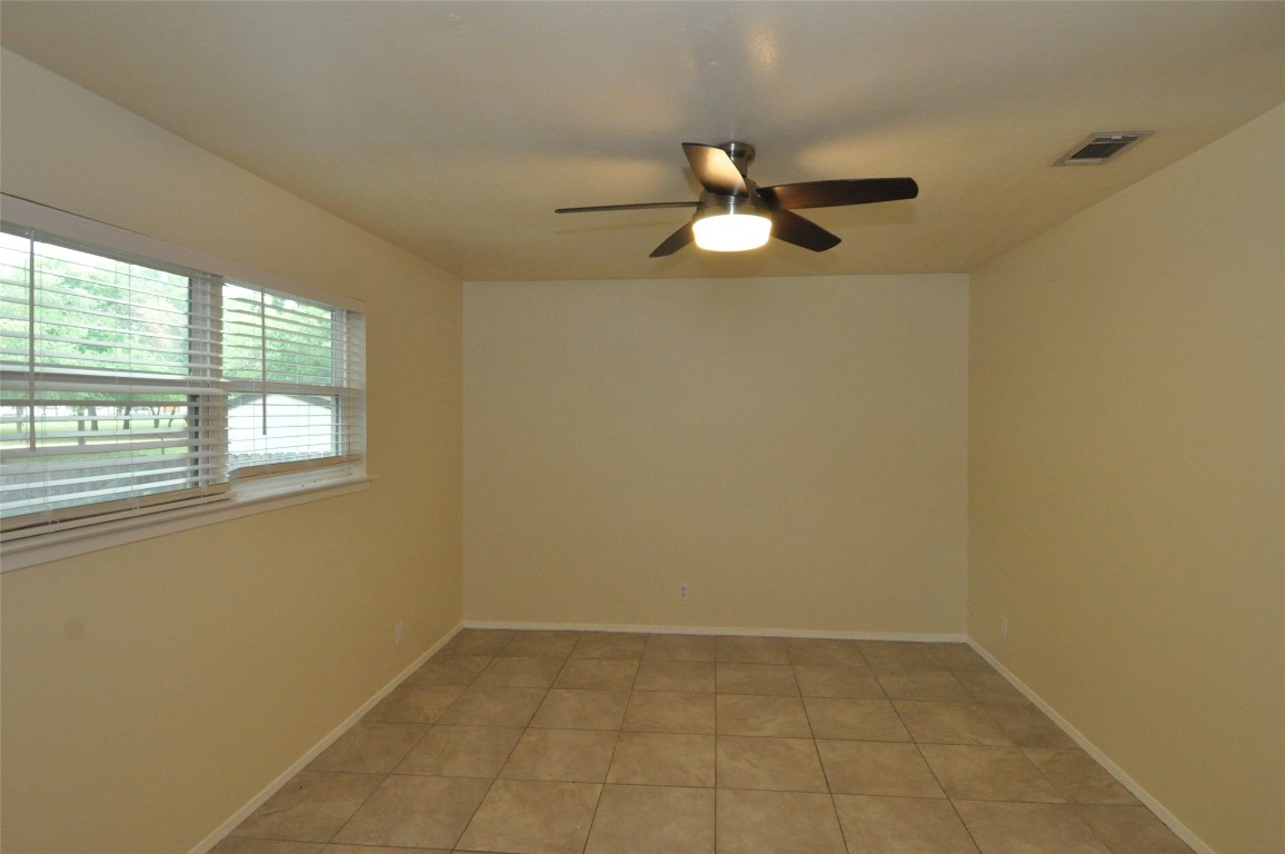 9910 Brasher Drive, Unit B Austin, TX 78748 - Photo 9 of 11 an empty room with a window