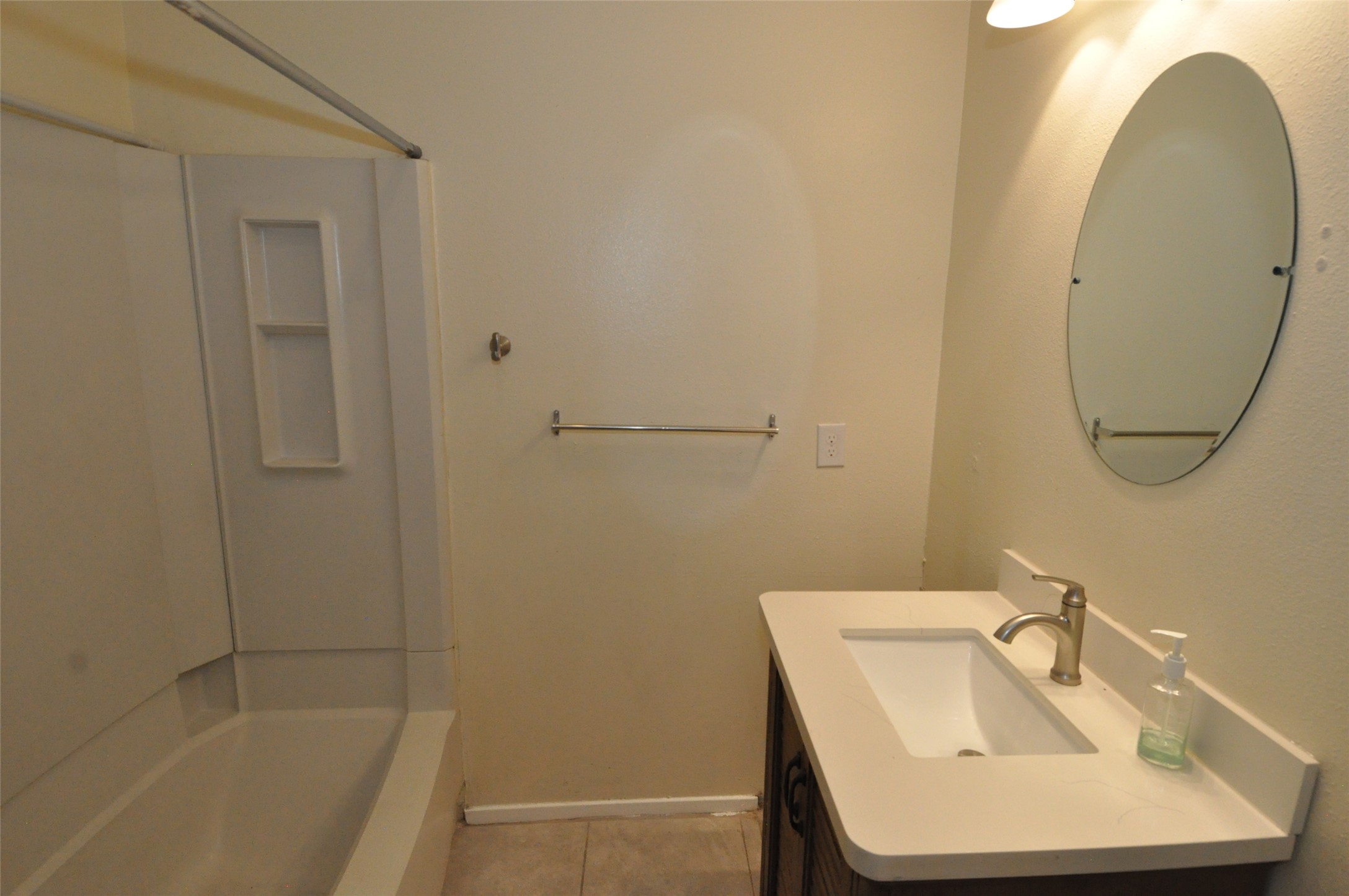 9910 Brasher Drive, Unit B Austin, TX 78748 - Photo 10 of 11 a bathroom with a sink a toilet and shower