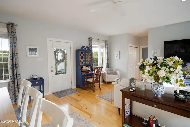 a view of a dining room with furniture and a window