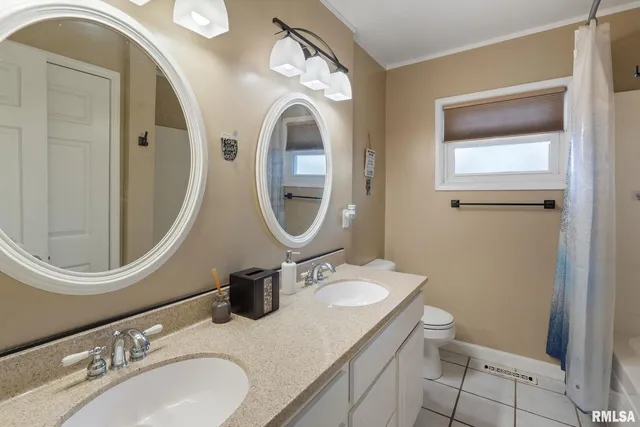 a bathroom with a toilet a sink and a mirror