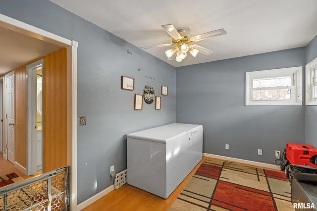 a kitchen with stainless steel appliances granite countertop a stove a sink dishwasher and a microwave oven with wooden cabinets