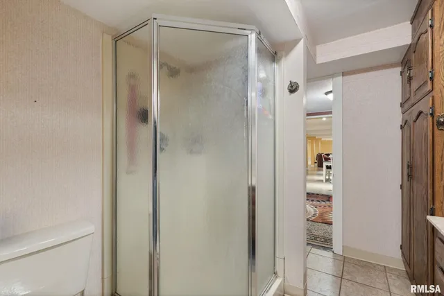 a bedroom with a bed and a table