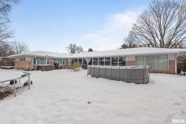 a wooden bench sitting in middle of a yard