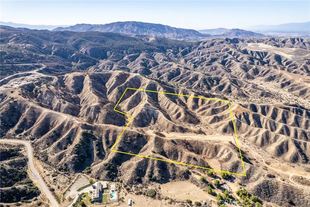 an aerial view of residential house and sandy dunes