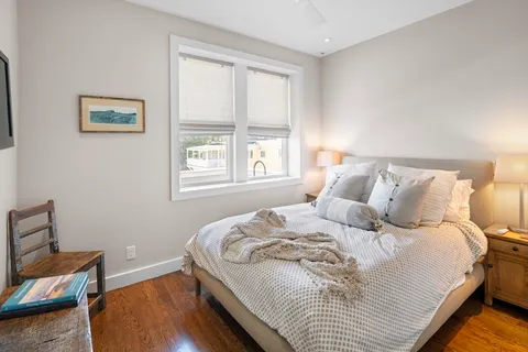 a bathroom with a granite countertop toilet a sink and shower