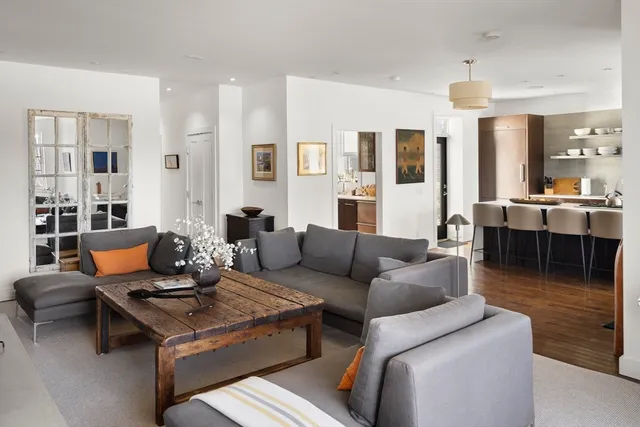 a living room with furniture and a table