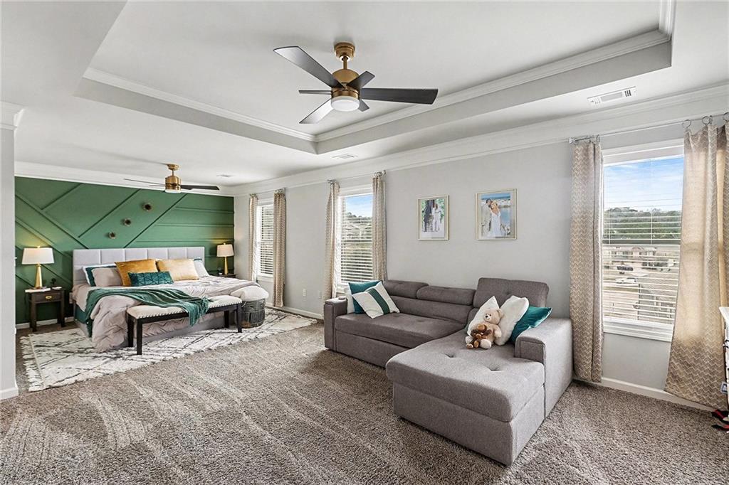 7284 Demeter Atlanta, GA 30349 - Photo 13 of 33 a living room with furniture ceiling fan and a window