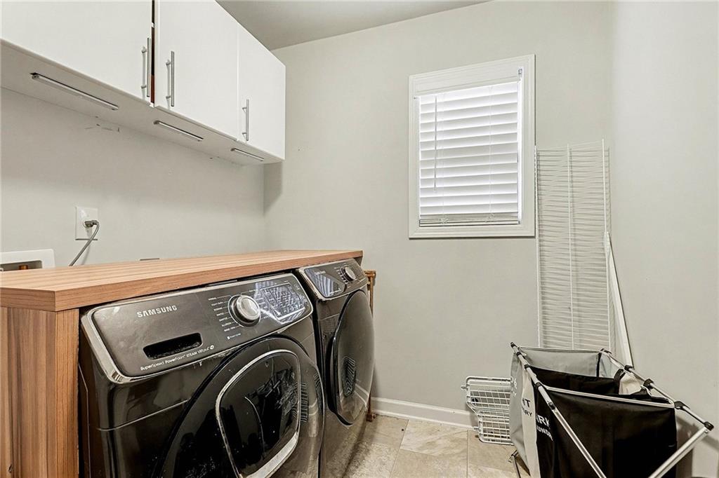7284 Demeter Atlanta, GA 30349 - Photo 16 of 33 a utility room with dryer and washer