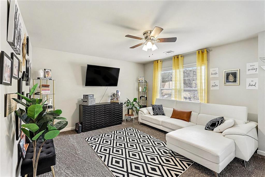 7284 Demeter Atlanta, GA 30349 - Photo 21 of 33 a bedroom with furniture and a flat screen tv