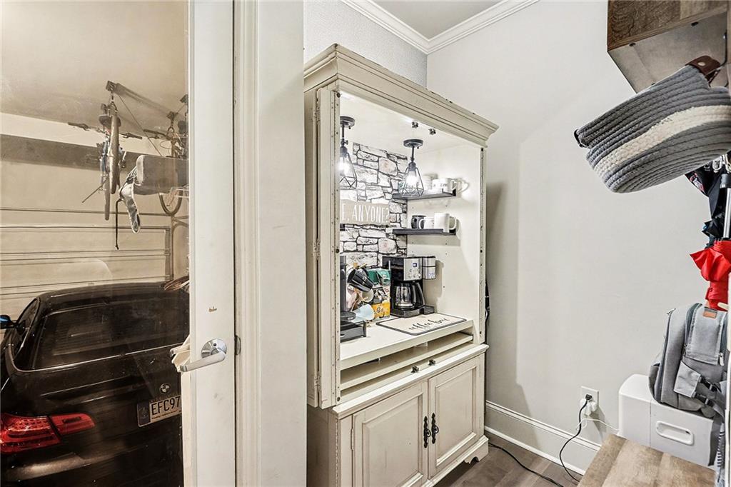 7284 Demeter Atlanta, GA 30349 - Photo 26 of 33 a kitchen with a refrigerator and a stove top oven