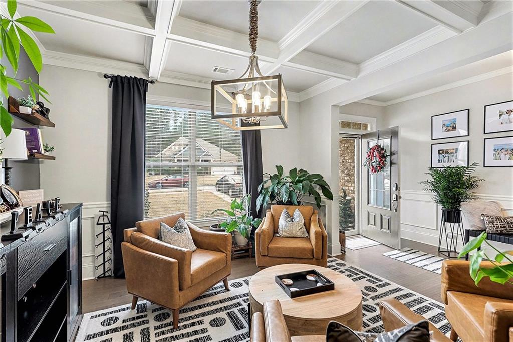 7284 Demeter Atlanta, GA 30349 - Photo 3 of 33 a living room with furniture and a chandelier