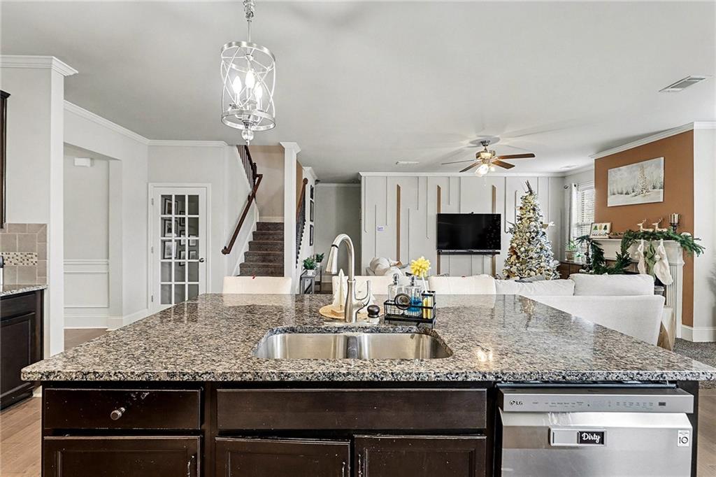 7284 Demeter Atlanta, GA 30349 - Photo 7 of 33 a bathroom with a granite countertop sink and a large mirror