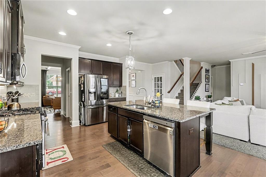 7284 Demeter Atlanta, GA 30349 - Photo 8 of 33 a kitchen with sink stove and refrigerator
