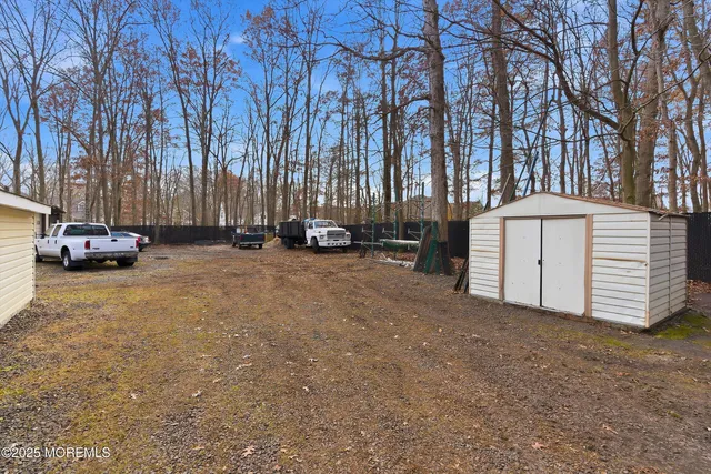 a view of street with parked cars