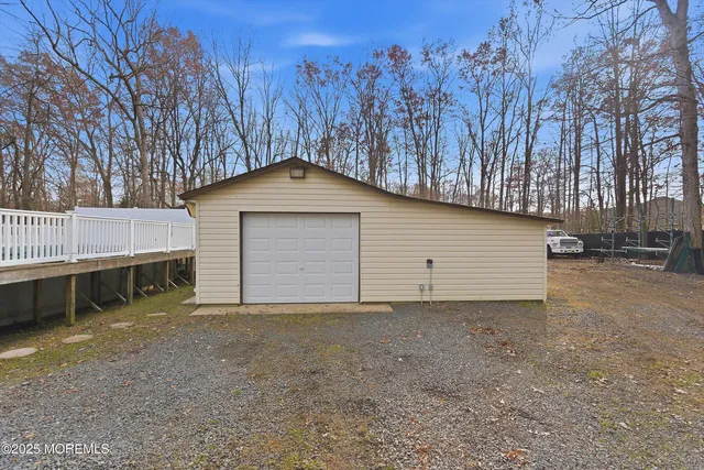 a view of a house with a yard and garage