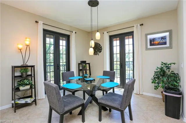 a dining room with furniture and window