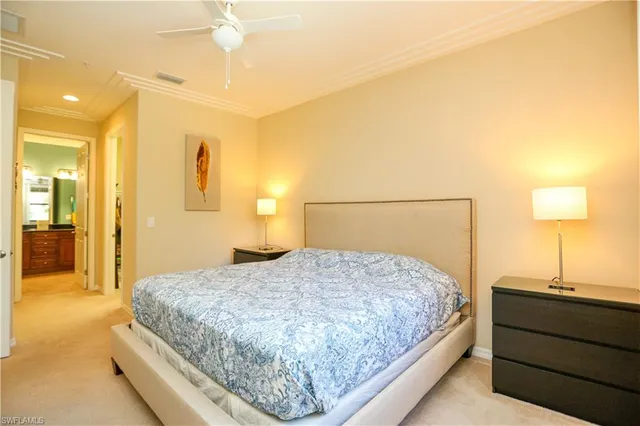 a bedroom with a bed and a lamp