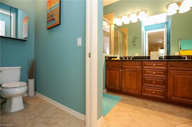 a spacious bathroom with a sink and a mirror