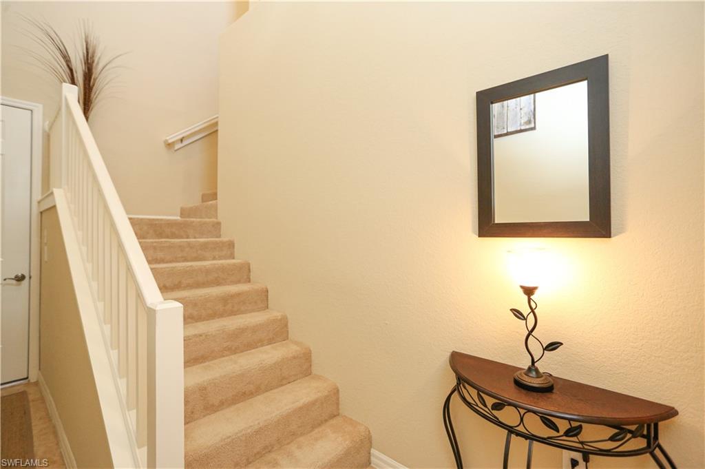 9082 Capistrano Street North, Unit 484 Naples, FL 34113 - Photo 27 of 35 a view of entryway with wooden floor