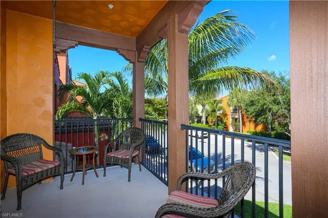 a view of a balcony with chairs