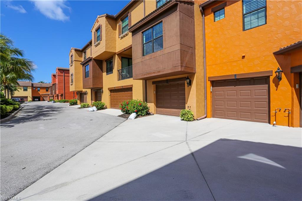 9082 Capistrano Street North, Unit 484 Naples, FL 34113 - Photo 31 of 35 a view of a street with houses