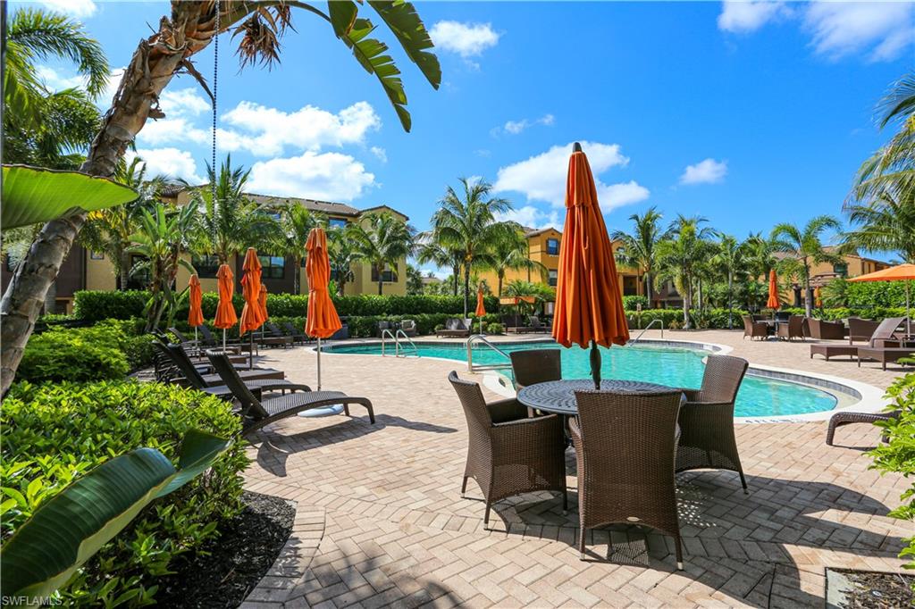 9082 Capistrano Street North, Unit 484 Naples, FL 34113 - Photo 34 of 35 a view of a swimming pool with a patio