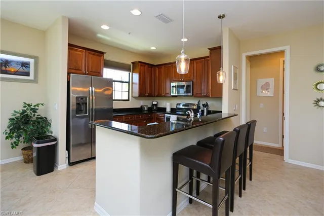 a kitchen with a table and chairs