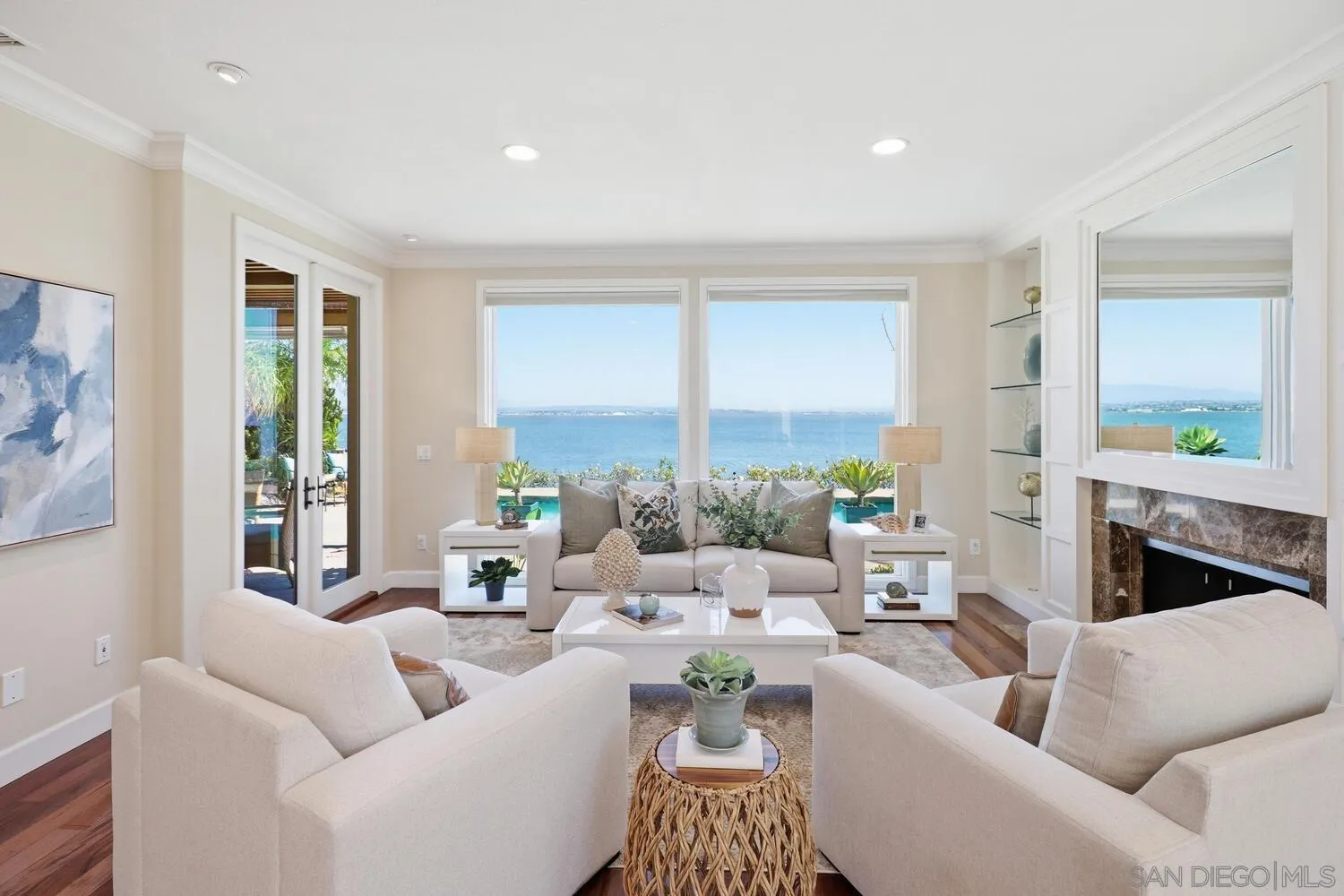 21 Spinnaker Way Coronado, CA 92118 - Photo 1 of 47 a living room with furniture and a potted plant