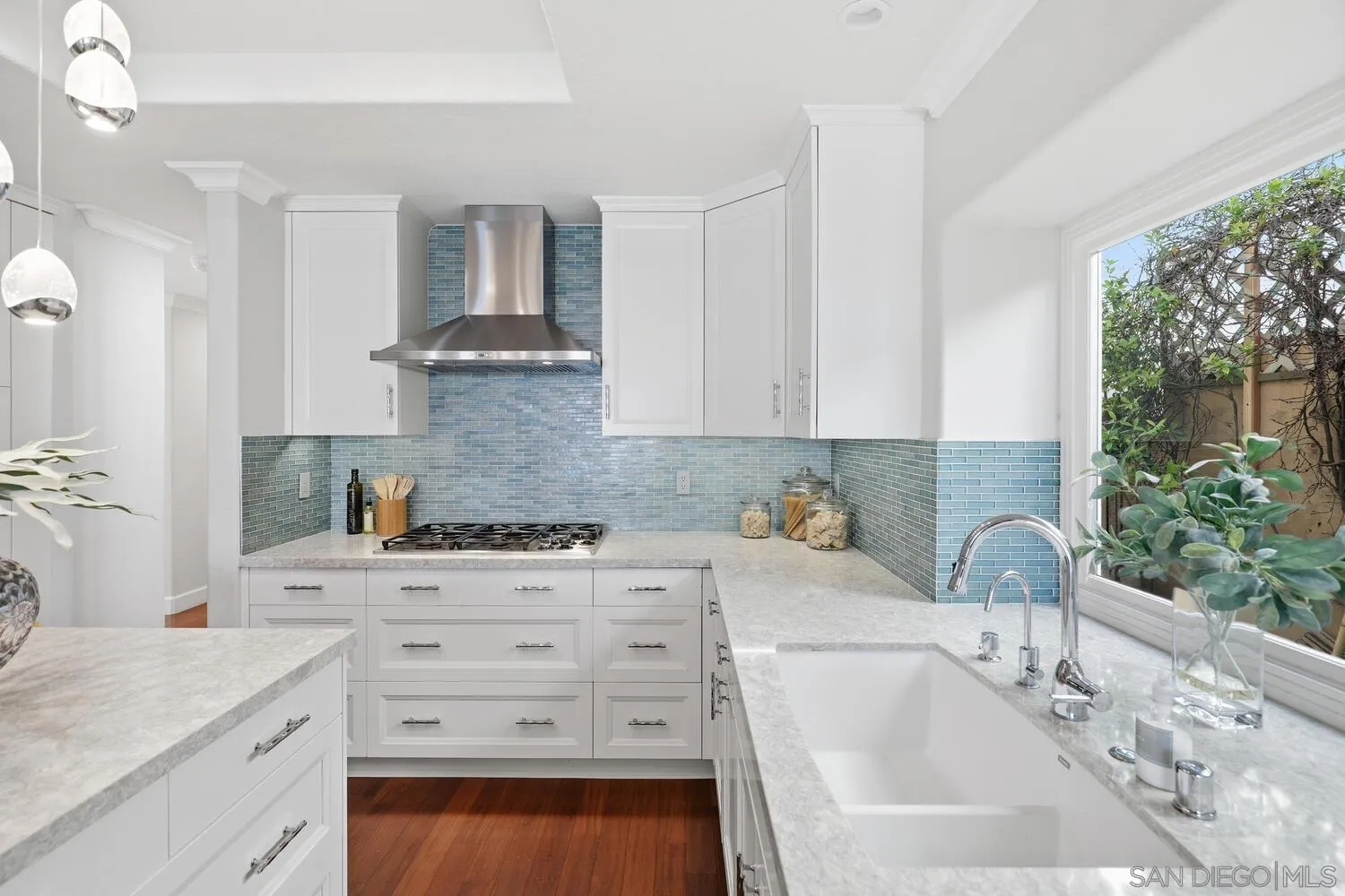 21 Spinnaker Way Coronado, CA 92118 - Photo 16 of 47 a kitchen with a sink stove and cabinets