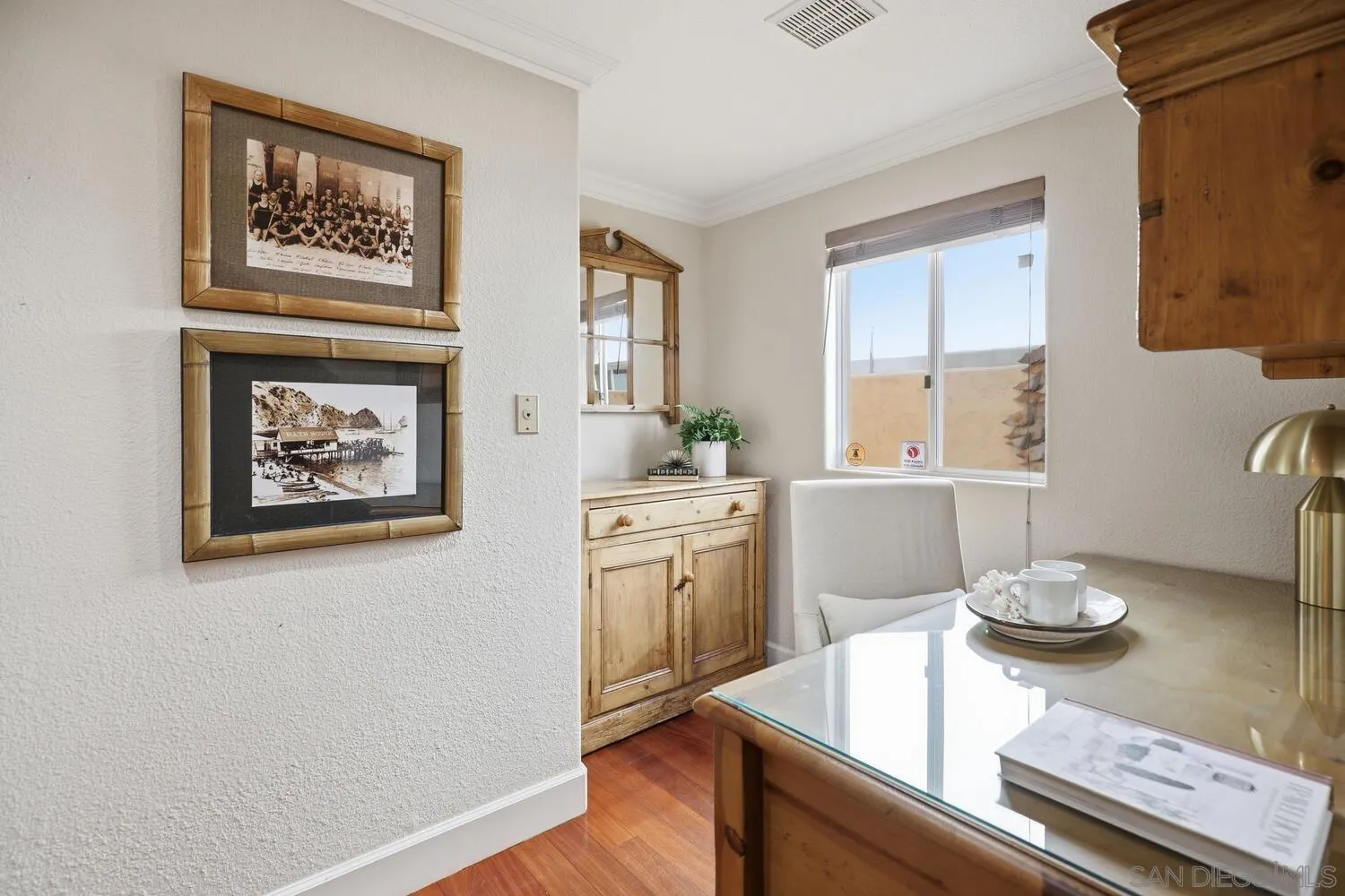 21 Spinnaker Way Coronado, CA 92118 - Photo 22 of 47 a room with a table and a painting on the wall