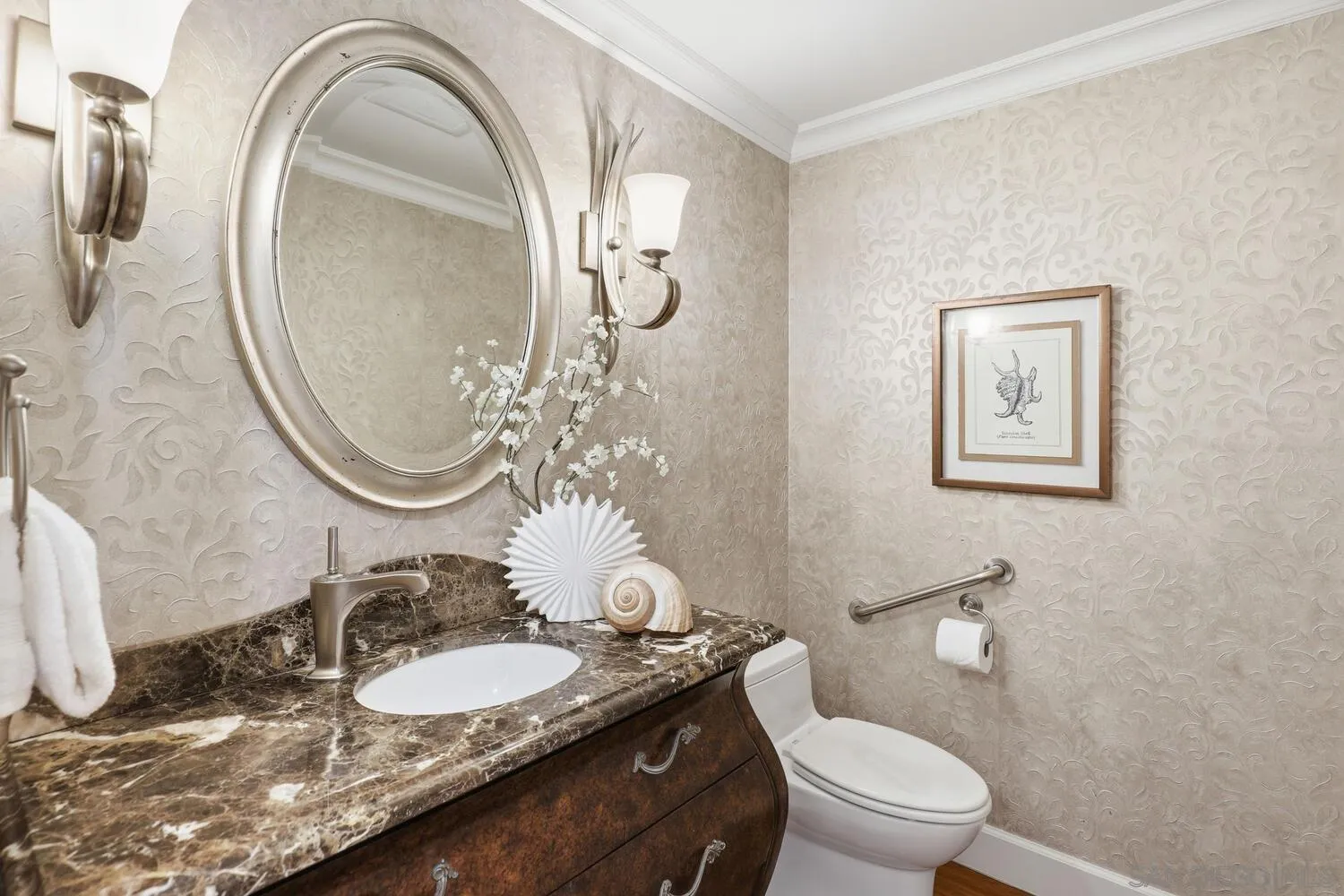 21 Spinnaker Way Coronado, CA 92118 - Photo 23 of 47 a bathroom with a granite countertop toilet a mirror and a sink