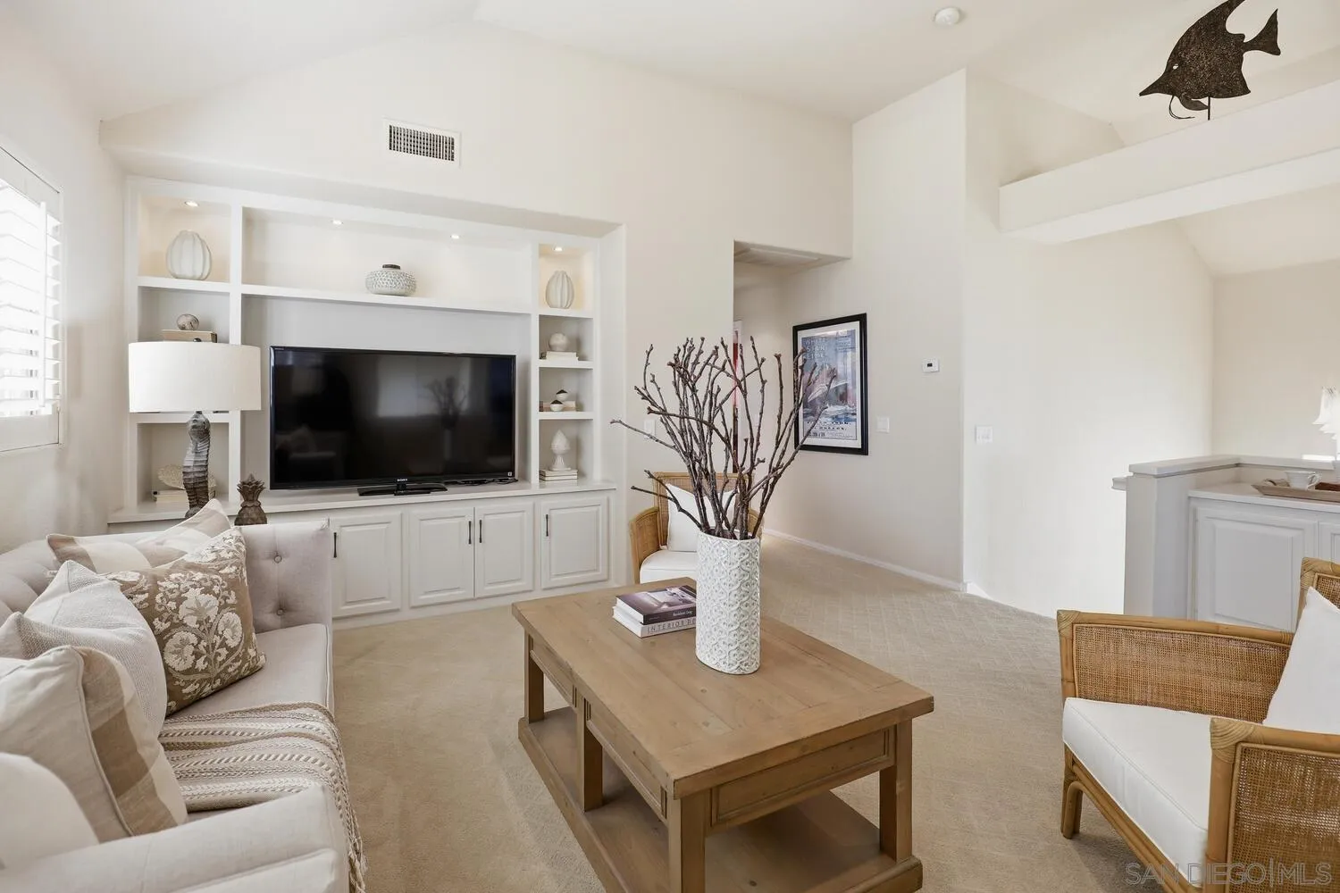 21 Spinnaker Way Coronado, CA 92118 - Photo 26 of 47 a living room with furniture and a flat screen tv