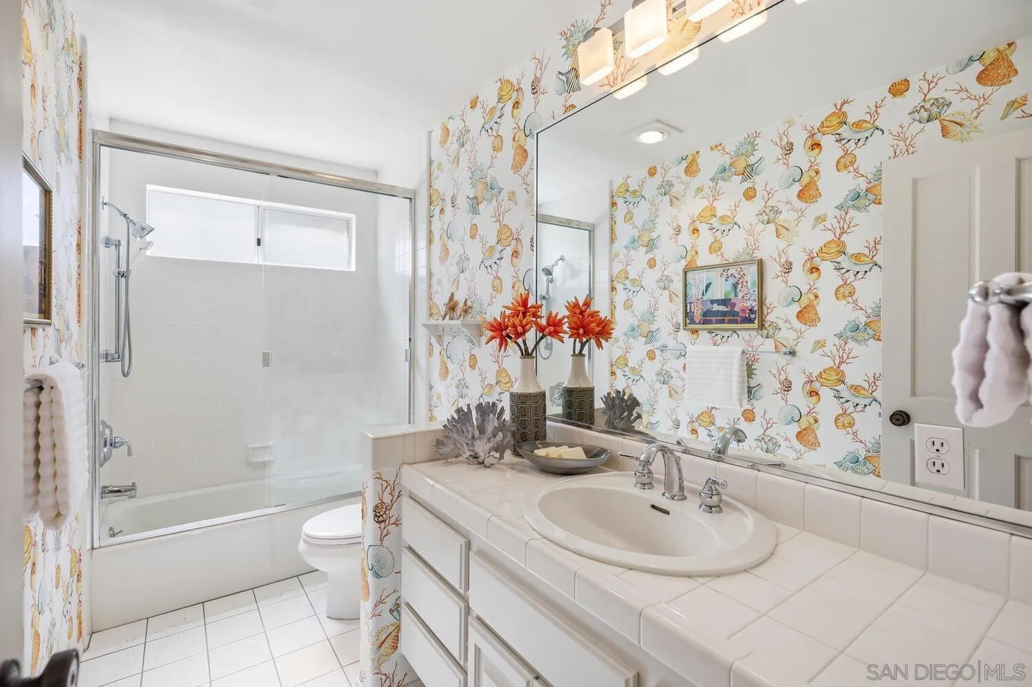 21 Spinnaker Way Coronado, CA 92118 - Photo 28 of 47 a bathroom with a sink toilet and shower