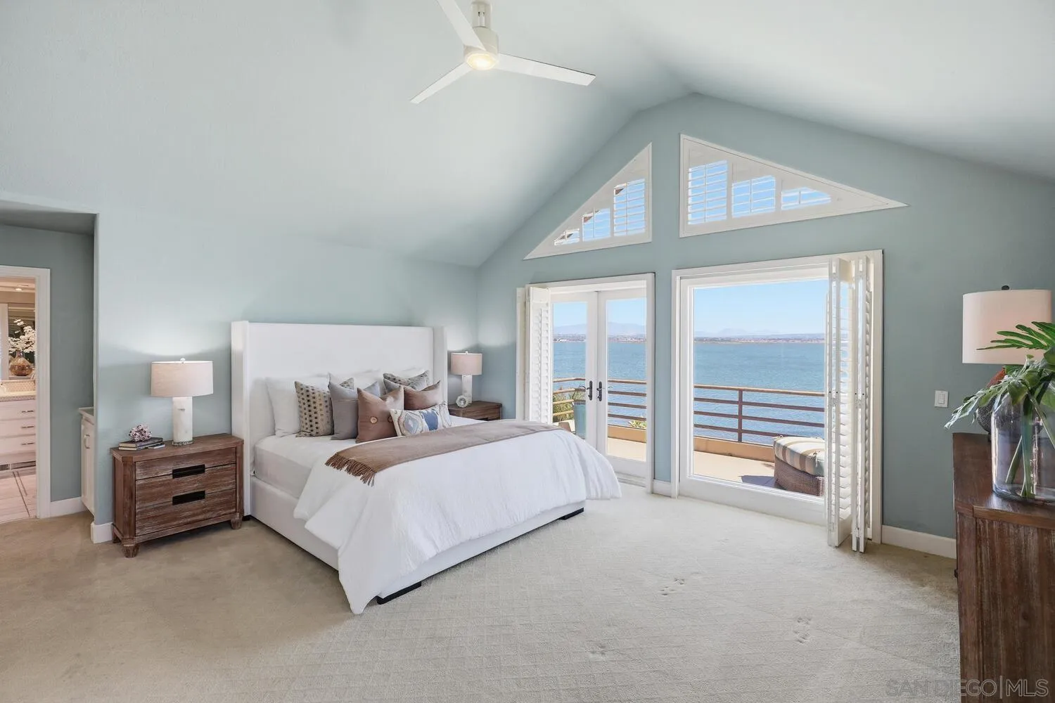 21 Spinnaker Way Coronado, CA 92118 - Photo 33 of 47 a bedroom with a bed and a large window