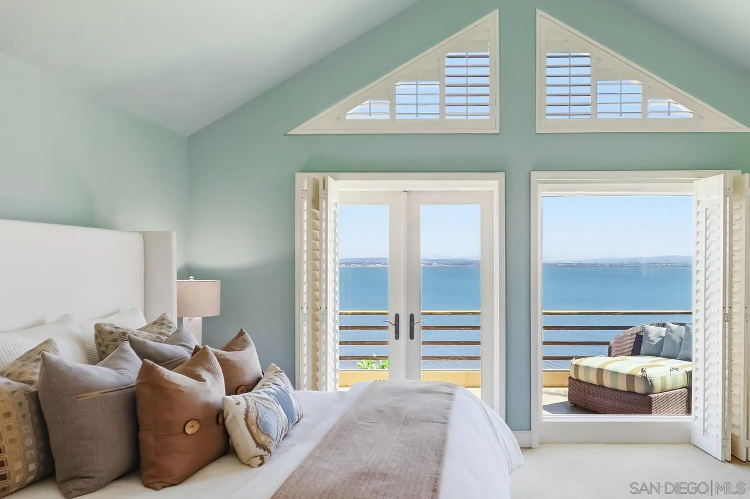 21 Spinnaker Way Coronado, CA 92118 - Photo 35 of 47 a bedroom with furniture and a large window