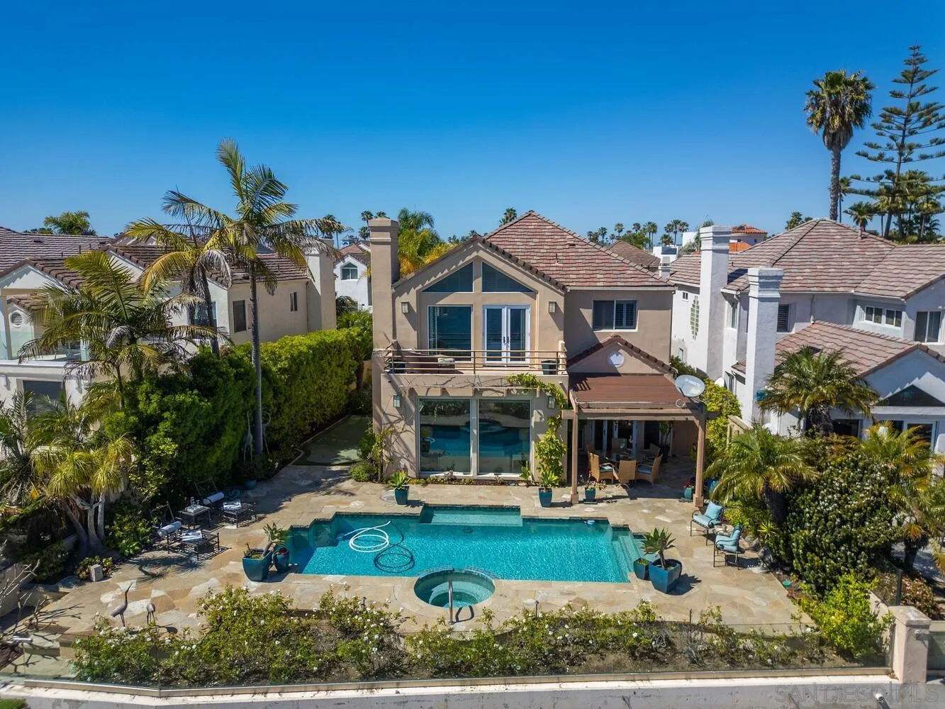 21 Spinnaker Way Coronado, CA 92118 - Photo 5 of 47 a front view of a house with garden