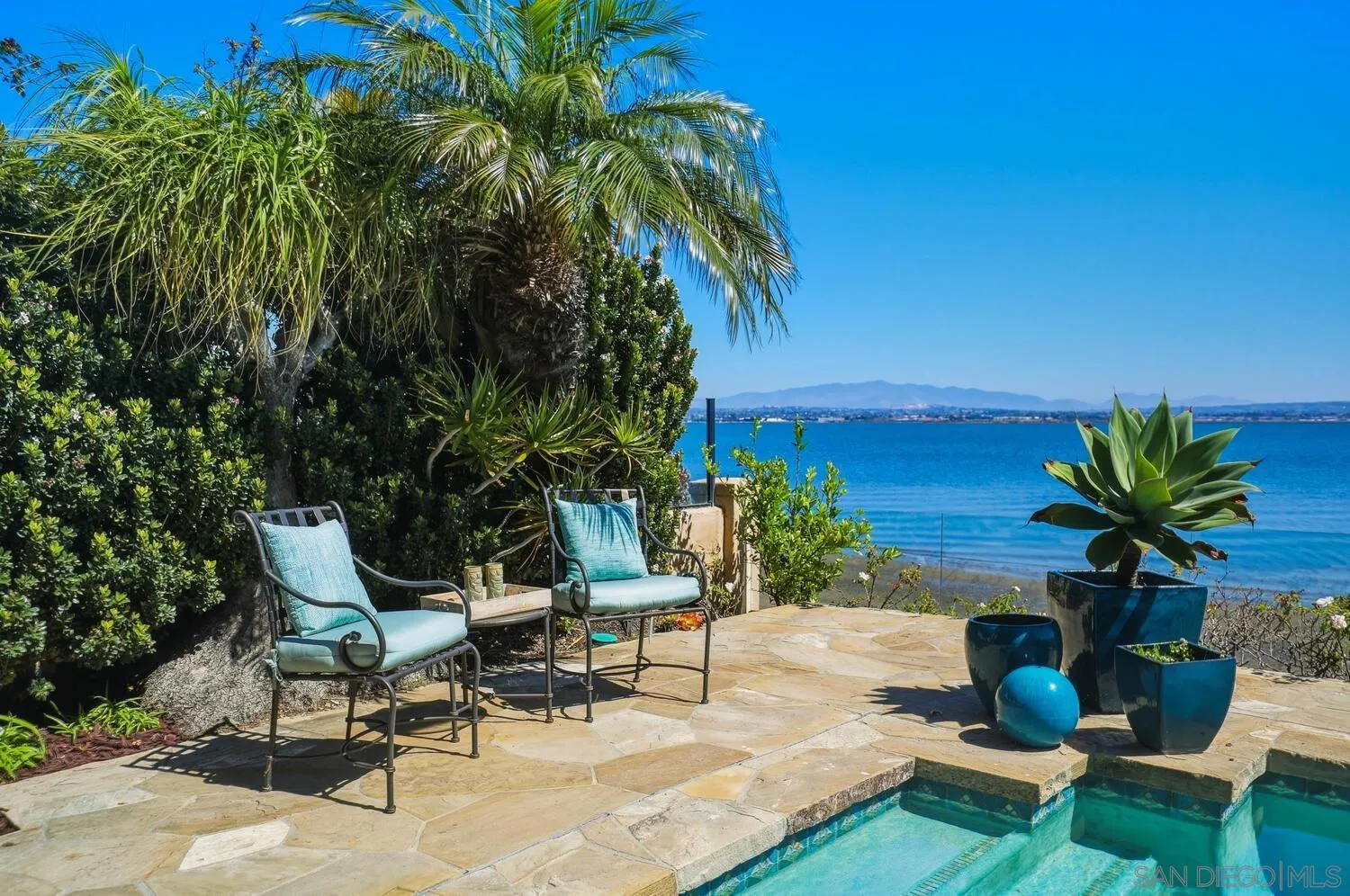 21 Spinnaker Way Coronado, CA 92118 - Photo 8 of 47 a view of a backyard with plants and a patio