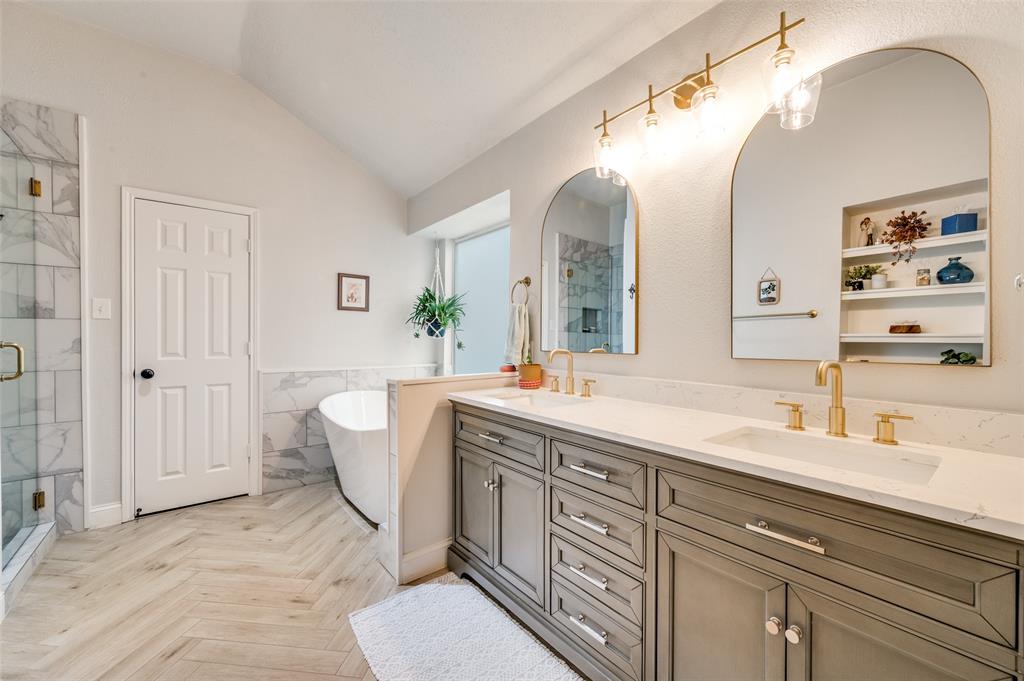 7306 Vista Ridge Lane Sachse, TX 75048 - Photo 14 of 23 a spacious bathroom with a double vanity sink mirror and bathtub