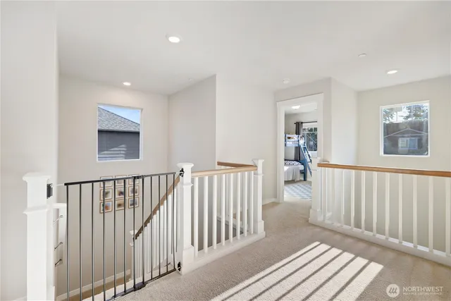 a view of a hallway with windows