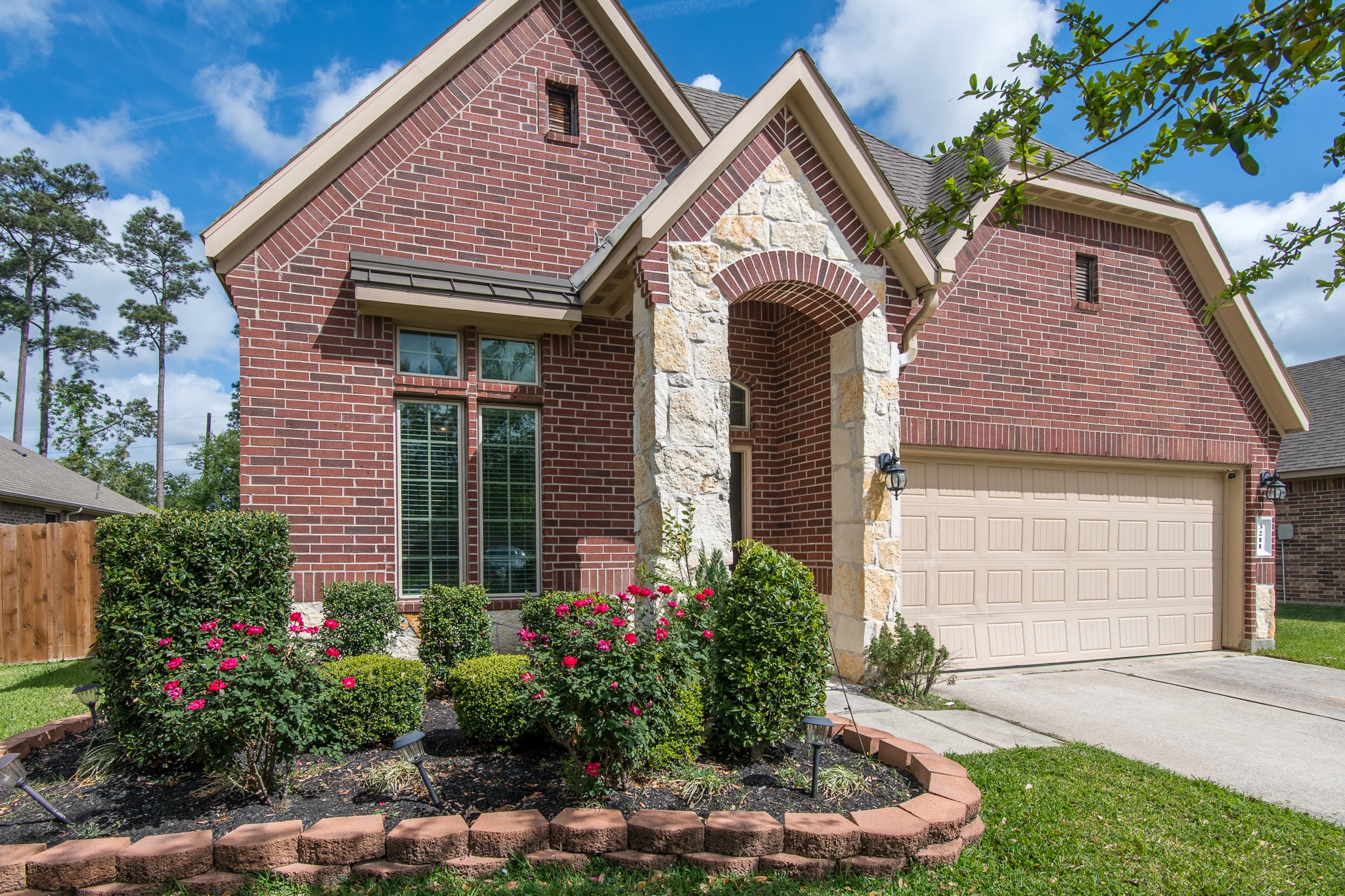 3211 Discovery Lane Conroe, TX 77301 - Photo 2 of 22 Gorgeous exterior landscaping and curb appeal