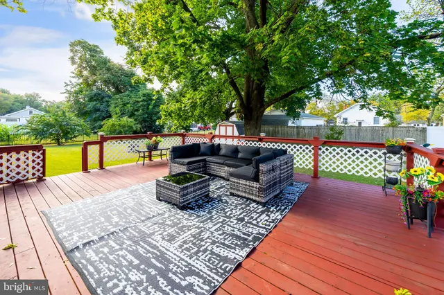 a view of a wooden deck with furniture