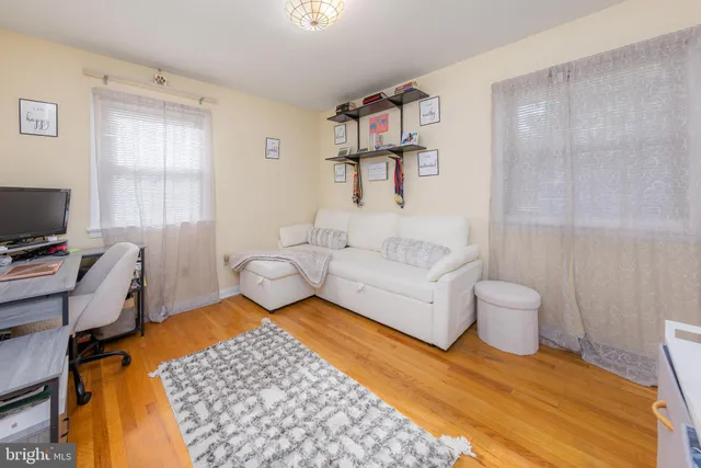 a spacious bedroom with a bed and a window