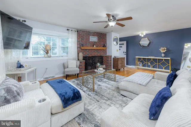 a view of a livingroom with furniture and a fireplace