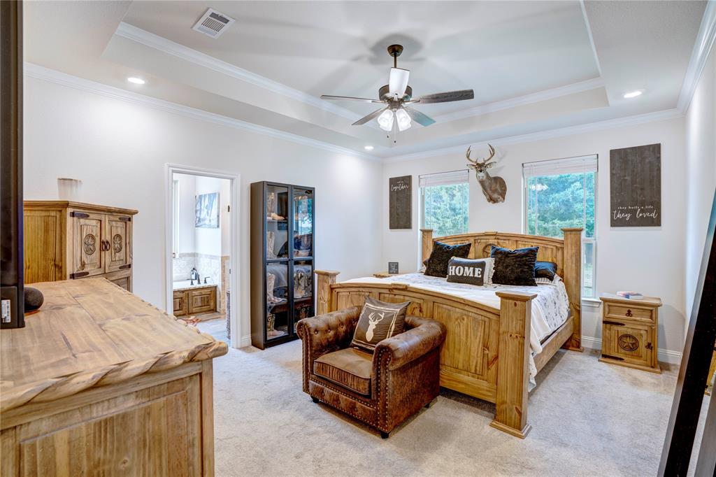 1355 Jay Bird Road Springtown, TX 76082 - Photo 24 of 40 a bed room with bed and ceiling fan