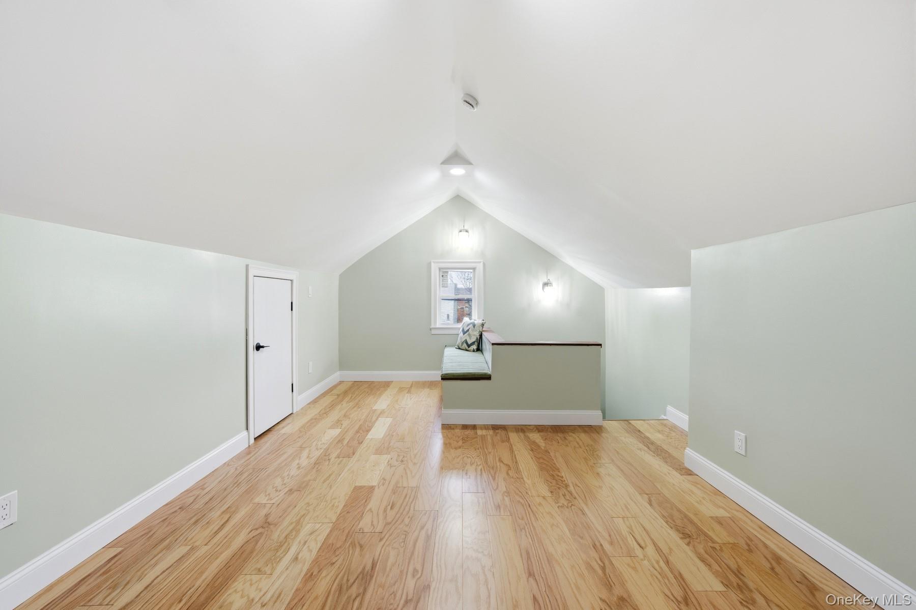 104-11 205th Street Queens, NY 11412 - Photo 33 of 50 Additional living space with light wood-style floors and lofted ceiling