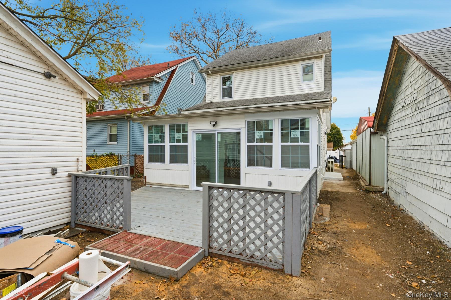 104-11 205th Street Queens, NY 11412 - Photo 45 of 50 Back of house featuring a deck and a shingled roof