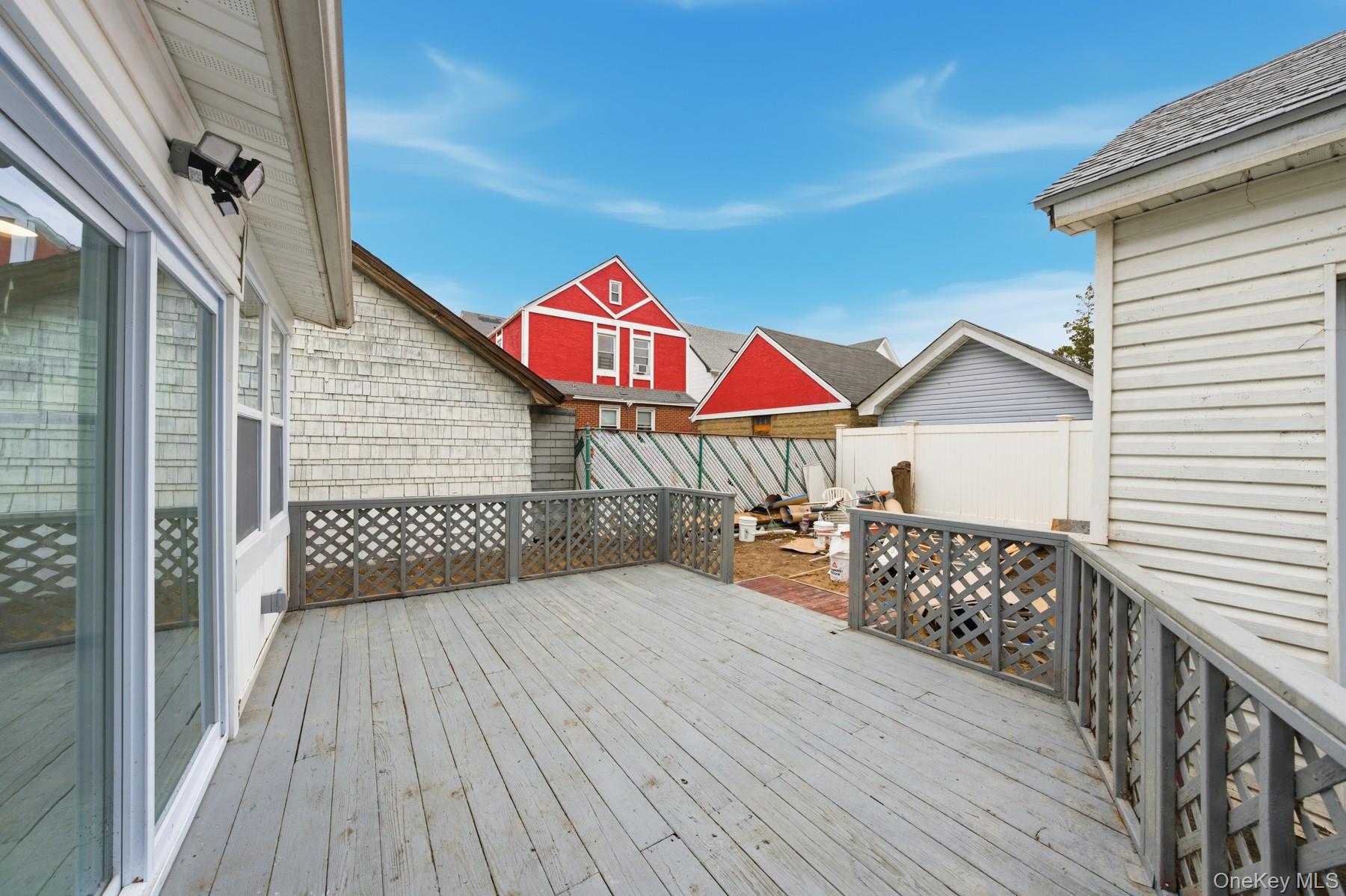 104-11 205th Street Queens, NY 11412 - Photo 47 of 50 Deck featuring a fenced backyard and a residential view