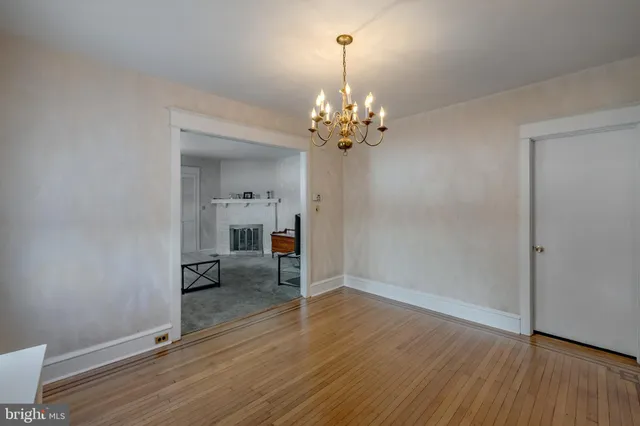 a kitchen with stainless steel appliances granite countertop a refrigerator a sink a stove and a refrigerator